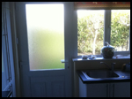 White uPVC back kitchen door and window